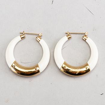 A pair of Dolce & Gabbana earrings.