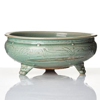 A celadon glazed tripod censer, Ming dynasty (1368-1644).