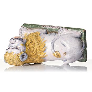 A pair of Luneville recumbent lions, circa 1780-1800.