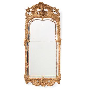 93. A Swedish giltwood rococo mirror, Stockholm, later part of the 18th century.