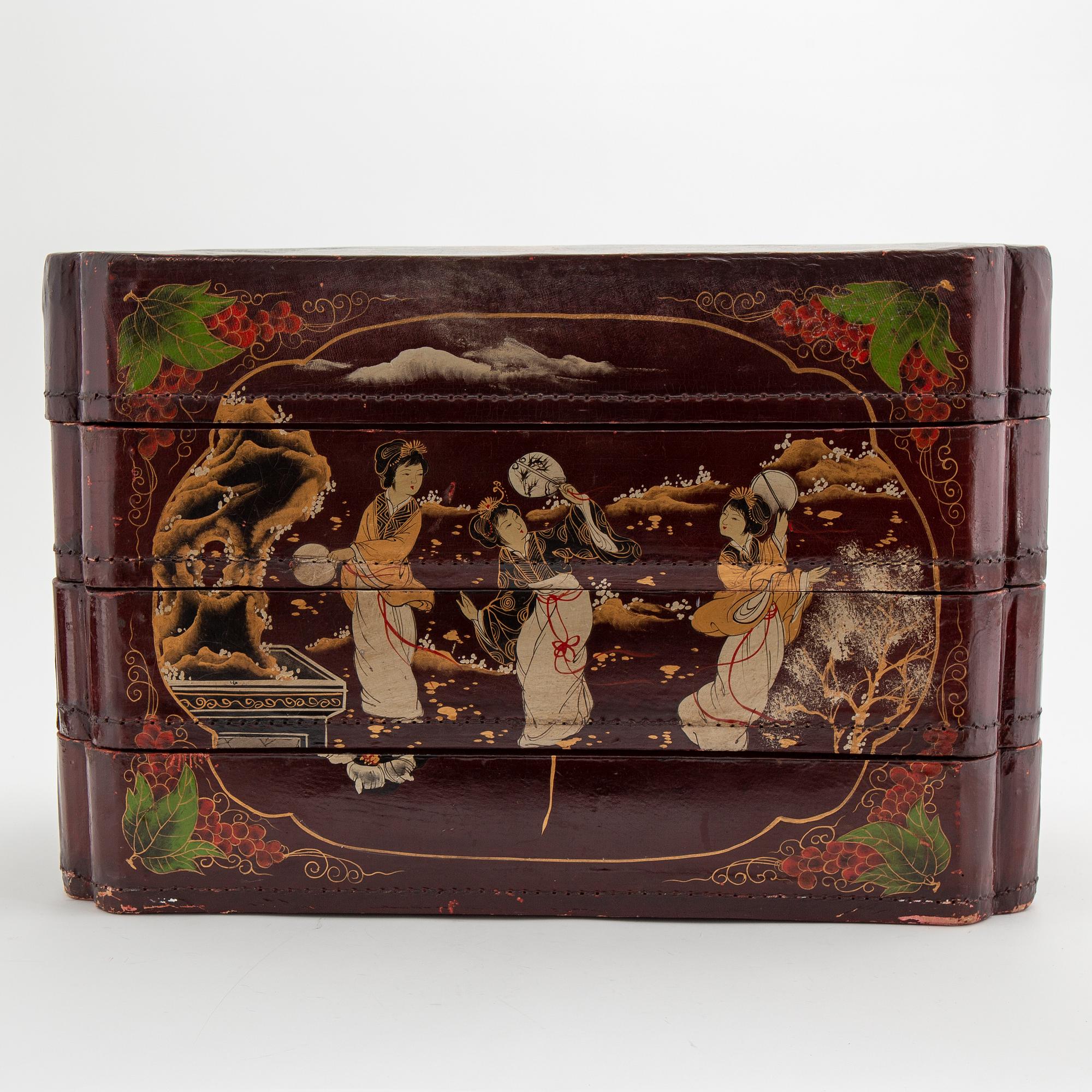 A painted Japanese four tiered box, 20th Century.