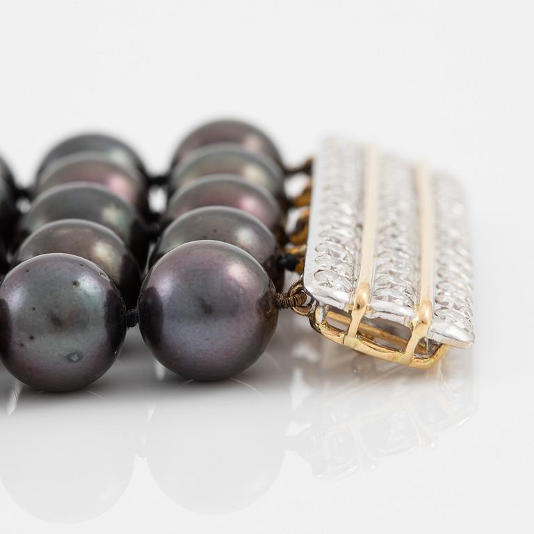 Necklace, five-row with cultured black pearls, 18K gold and white gold with brilliant-cut diamonds.