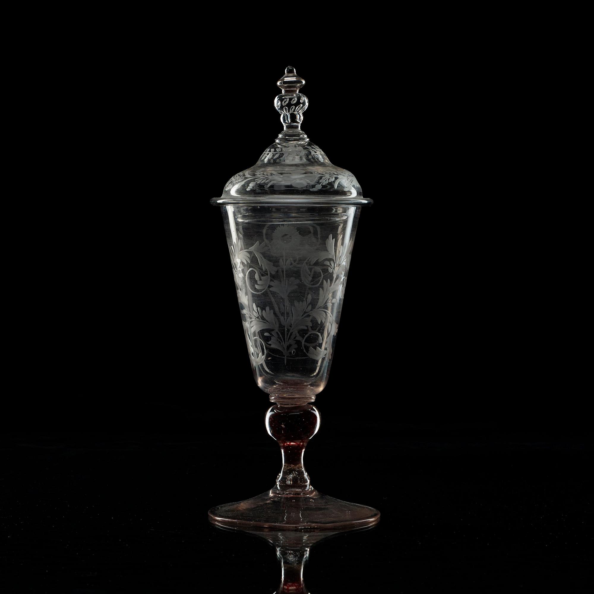 An engraved armorial goblet with cover, 18th Century.