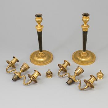 A pair of French Directoire late 18th century ormolu candelabra for three candles.