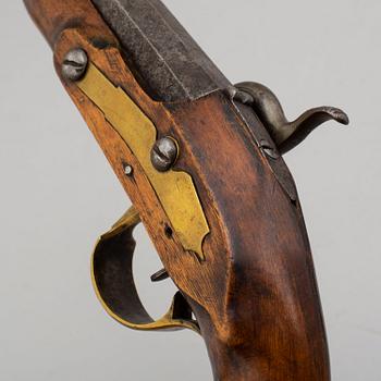 Two Swedish percussion pistols with birch stocks and brass mounts.