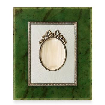 220. A Fabergé nephrite, silver and enamel frame, workmaster Antti Nevalainen, St Petersburg, 1899-1908.