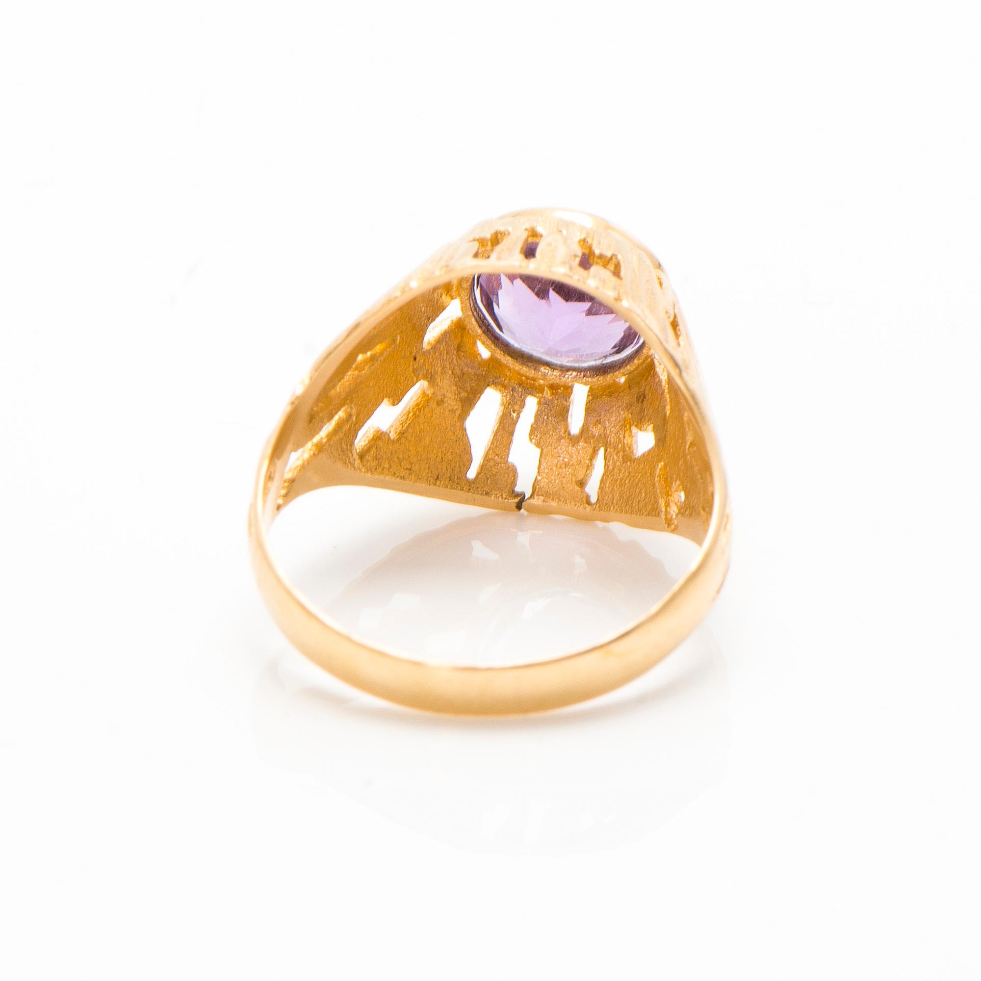 A set of 14K gold earrings and a ring with amethysts.