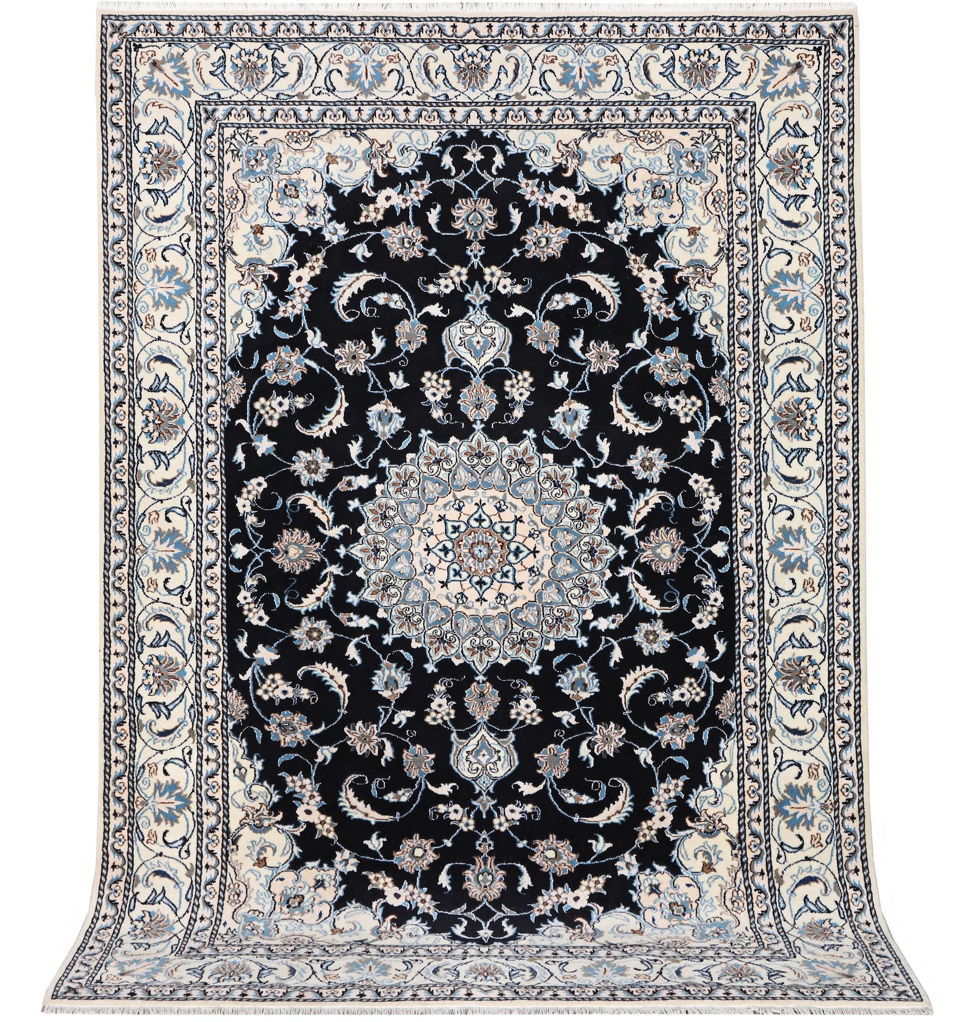 A Nain carpet, part silk, c. 286 x 206 cm.