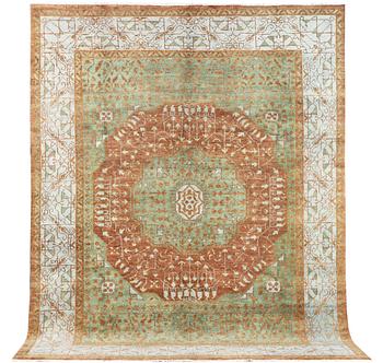 An oriental carpet with Mamluk design, c. 358 x 281 cm.