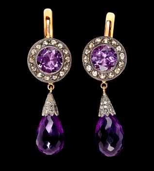 1015. A pair of amethyst and diamond ear pendants.