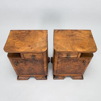 A pair of around 1930s bedside tables.
