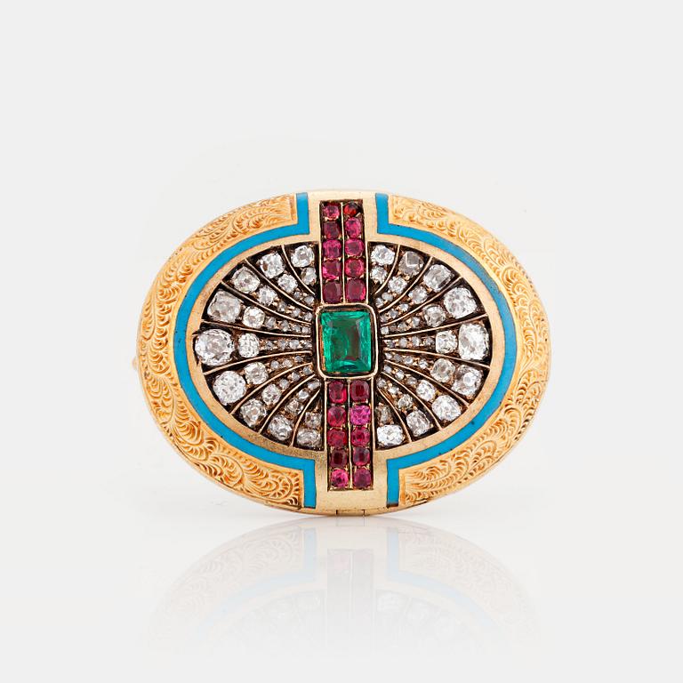 A LOCKET/BROOCH set with an emerald, old-cut diamonds and rubies and with blue enamel.