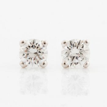 Brilliant-cut diamond stud earrings.