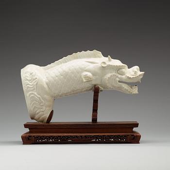 A blanc de chine figure of a dragonfish, Qing dynasty, presumably 18th Century.