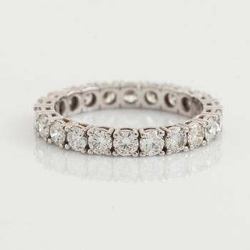 Brilliant cut diamond eternity ring.