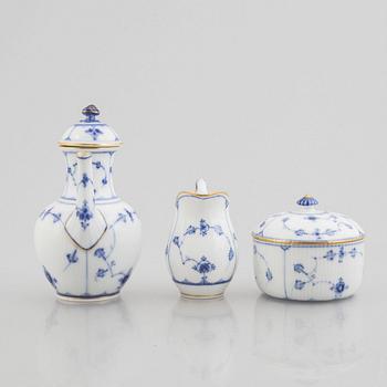 A "Blue fluted"/"Musselmalet riflet" porcelain mocha pot, a sugar box with cover and a creamer, Royal Copenhagen, 19th c.