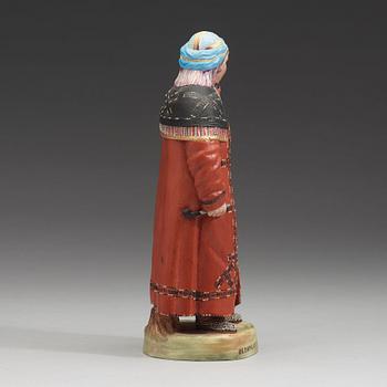 A Russian bisquit figure depicting a Khanty woman, Kusnetsov, first half of 20th Century.