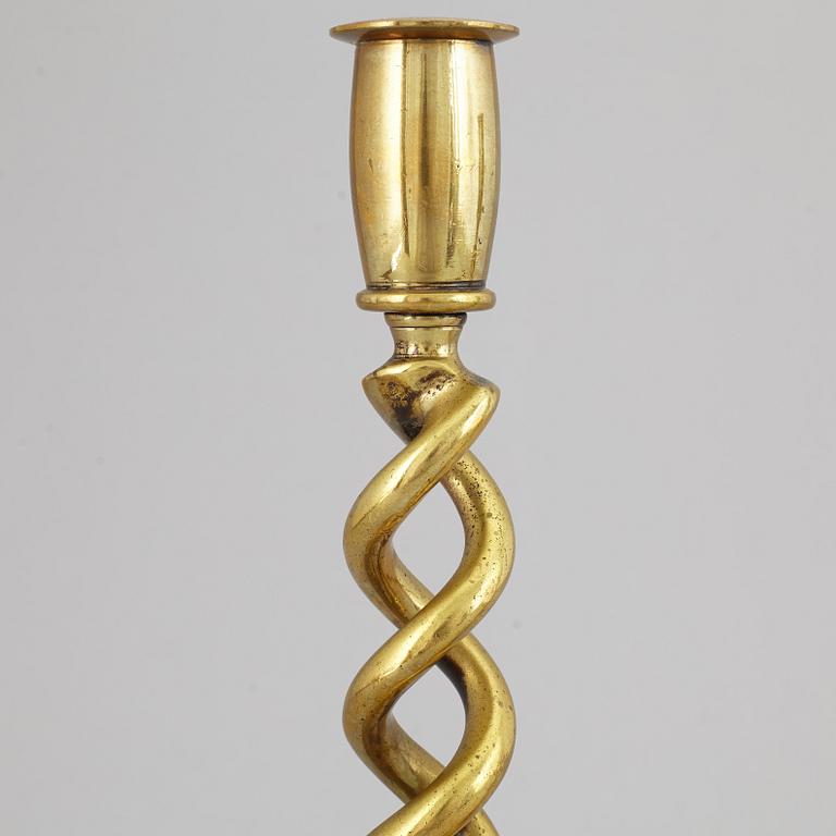 A pair of brass candle sticks. possibly English, circa 1900.
