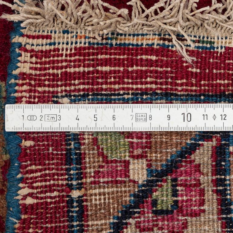A semi-antique Mashad carpet, northeastern Persia, c. 404 x 307 cm.