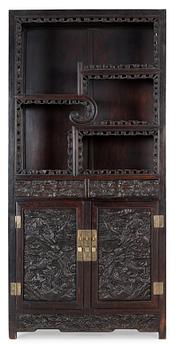 157. A Chinese hardwood cabinet, early 20th Century.
