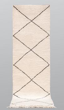 A Moroccan runner carpet, 300 x 88 cm.