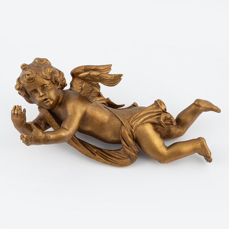 A carved and giltwood sculpture of a putto, 18th and 19th century.