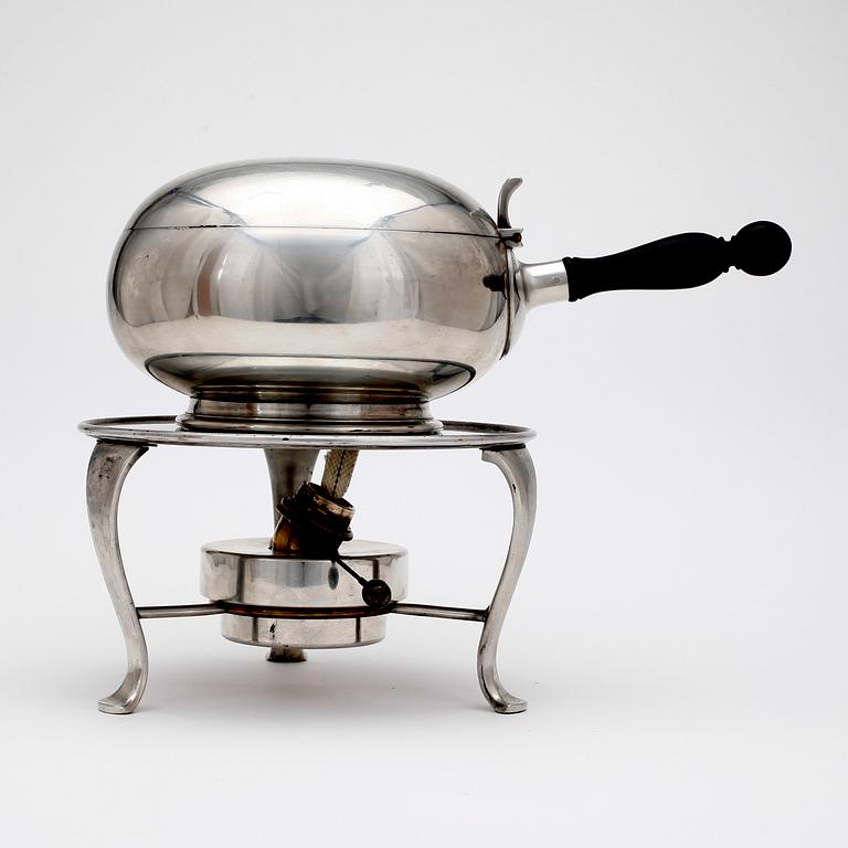 A Svenskt Tenn pewter sauce pot on stand with a heater, Stockholm 1950 and 1954.