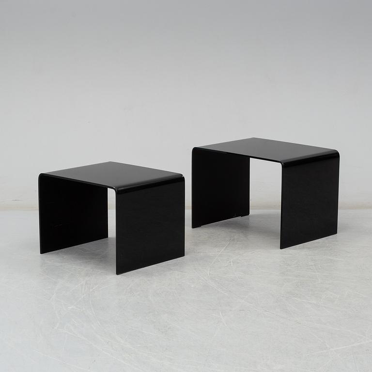 Two modern glass tables.