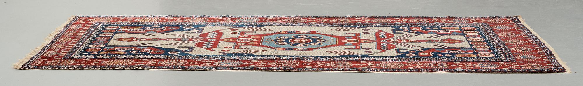 A CARPET, an antique/semi-antique Shirvan, ca 234 x 130 cm (as well as the ends with 1 cm flat weave).