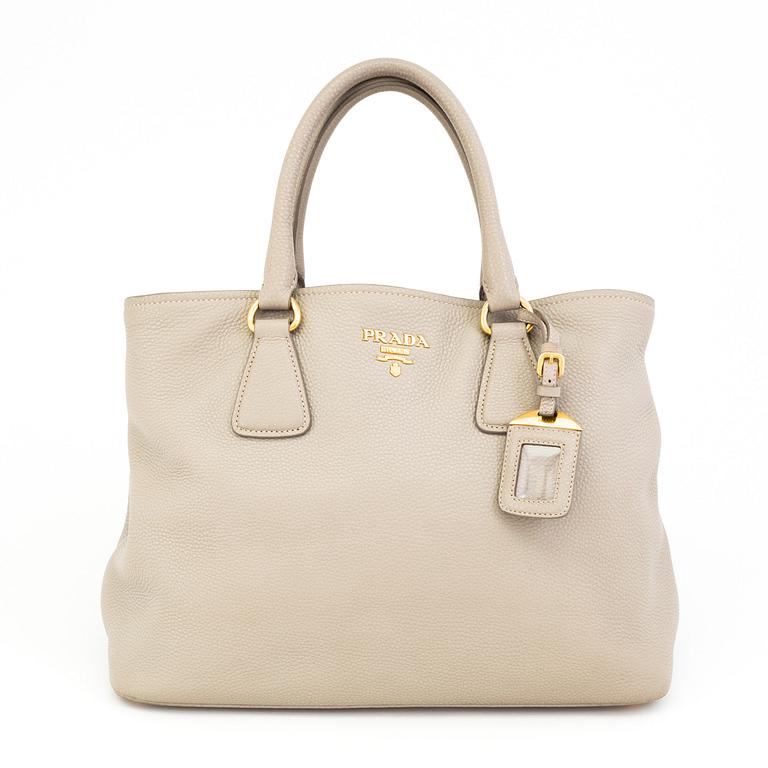 A tote/crossbody handbag by Prada.