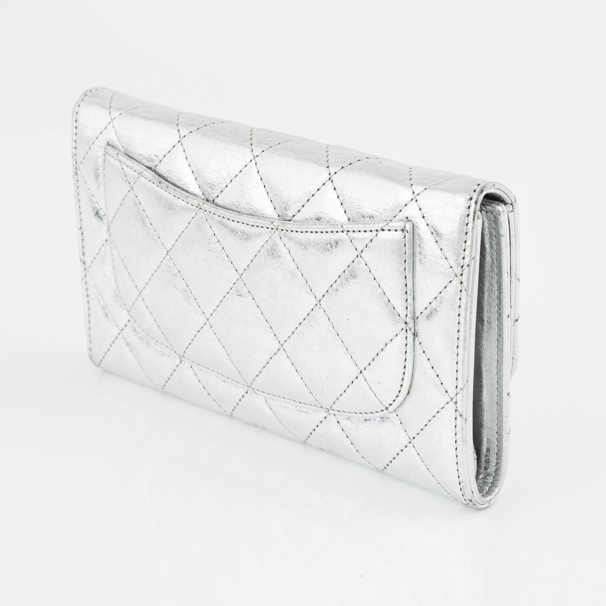 Chanel, a quilted silver leather wallet, 2006-08.
