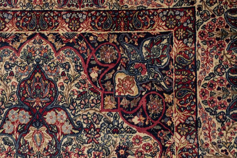 A carpet, semi-antique Kerman Laver, ca 242 x 142 cm.