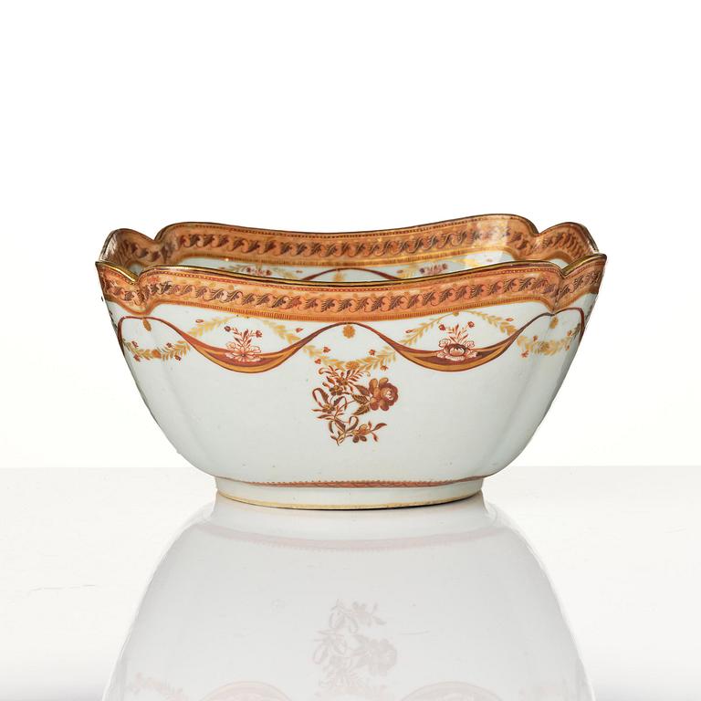 An oval vegetable tureen with cover and a pillow shaped bowl, Qing dynasty, late 18th century.