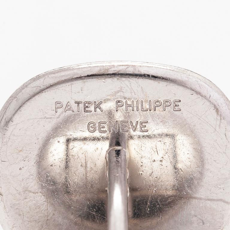 Patek Philippe, a pair of 18K whitegold 'Calatrava' cufflinks.
