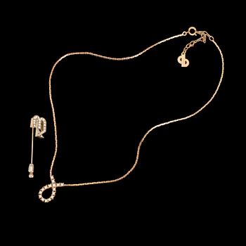 542. A 1980s brooch and necklace by Christian Dior.