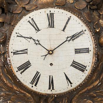 A 18th century wall clock.