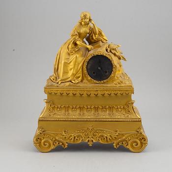 A French gilt bronze mantle clock, mid 19th century.