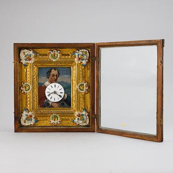 A Schwarzwald area wall pendulum clock with mechanical eye-movment, mid 19thcentury.