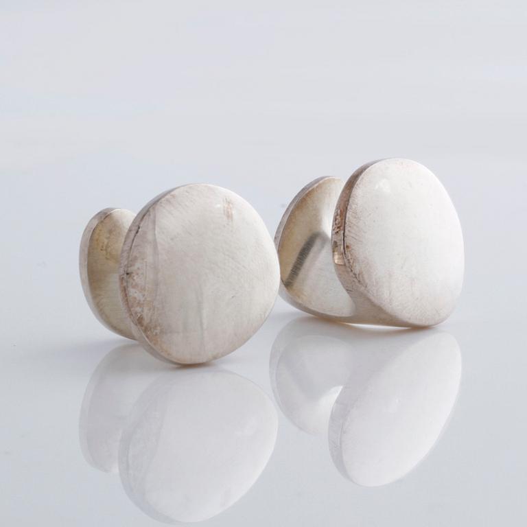 A pair of cufflink, by Ole Lynggaard.