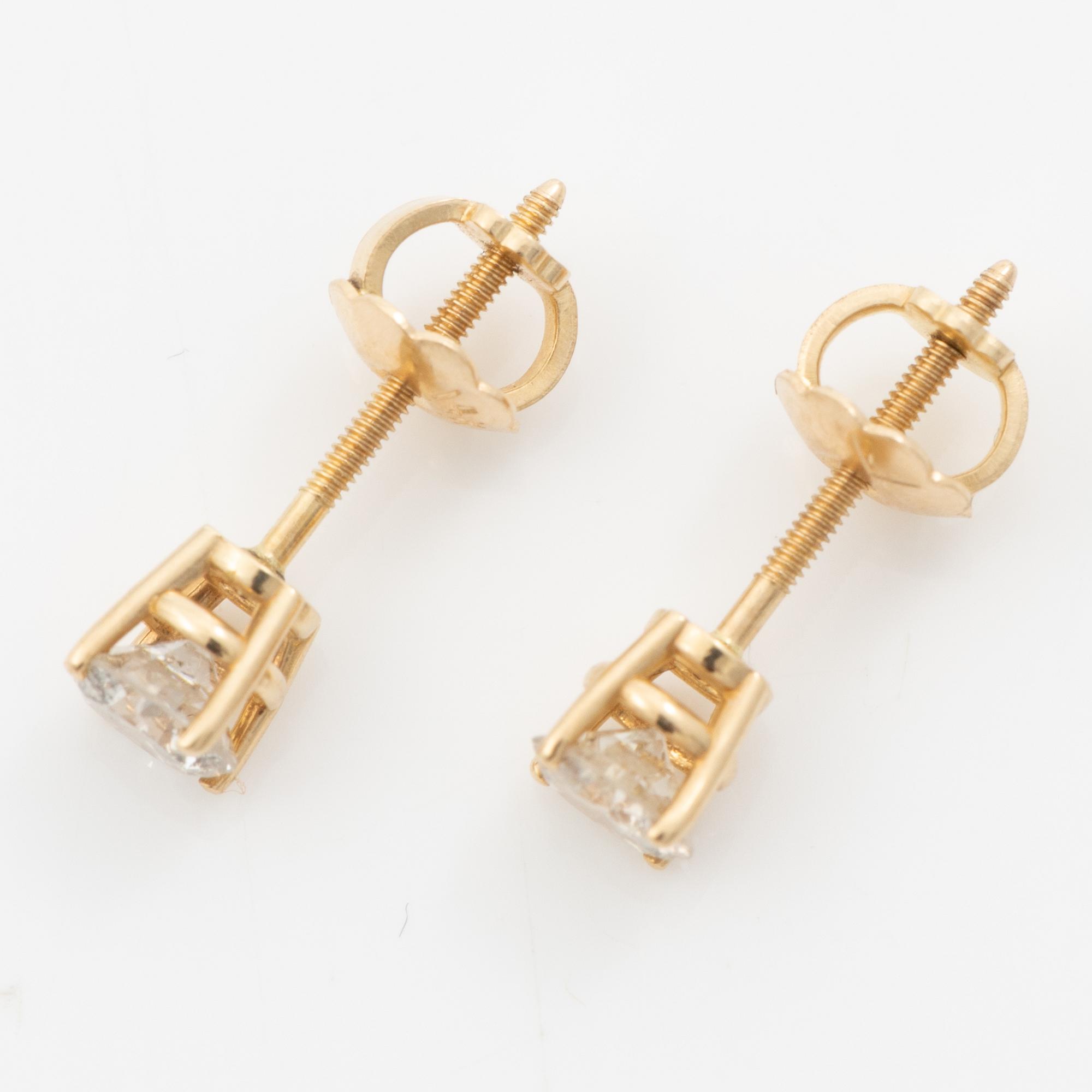 A pair of 14K gold earrings with round brilliant-cut diamonds.