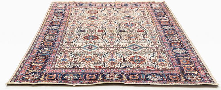 A carpet, semi-antique Tabriz, figural, ca 307 x 201 cm.