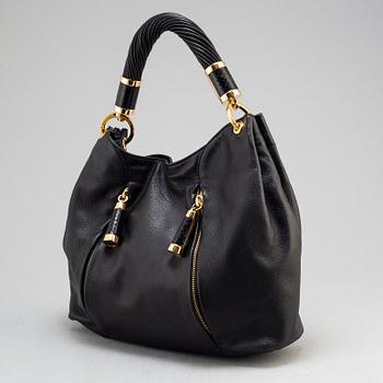 MICHAEL KORS, a black leather handbag.