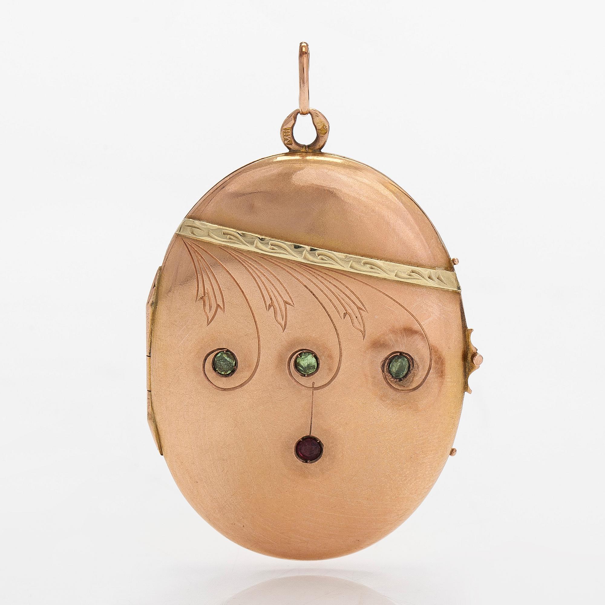 A 14K gold medallion/pendant, with demantoids and a garnet glass doublet. Odessa 1908-1926.