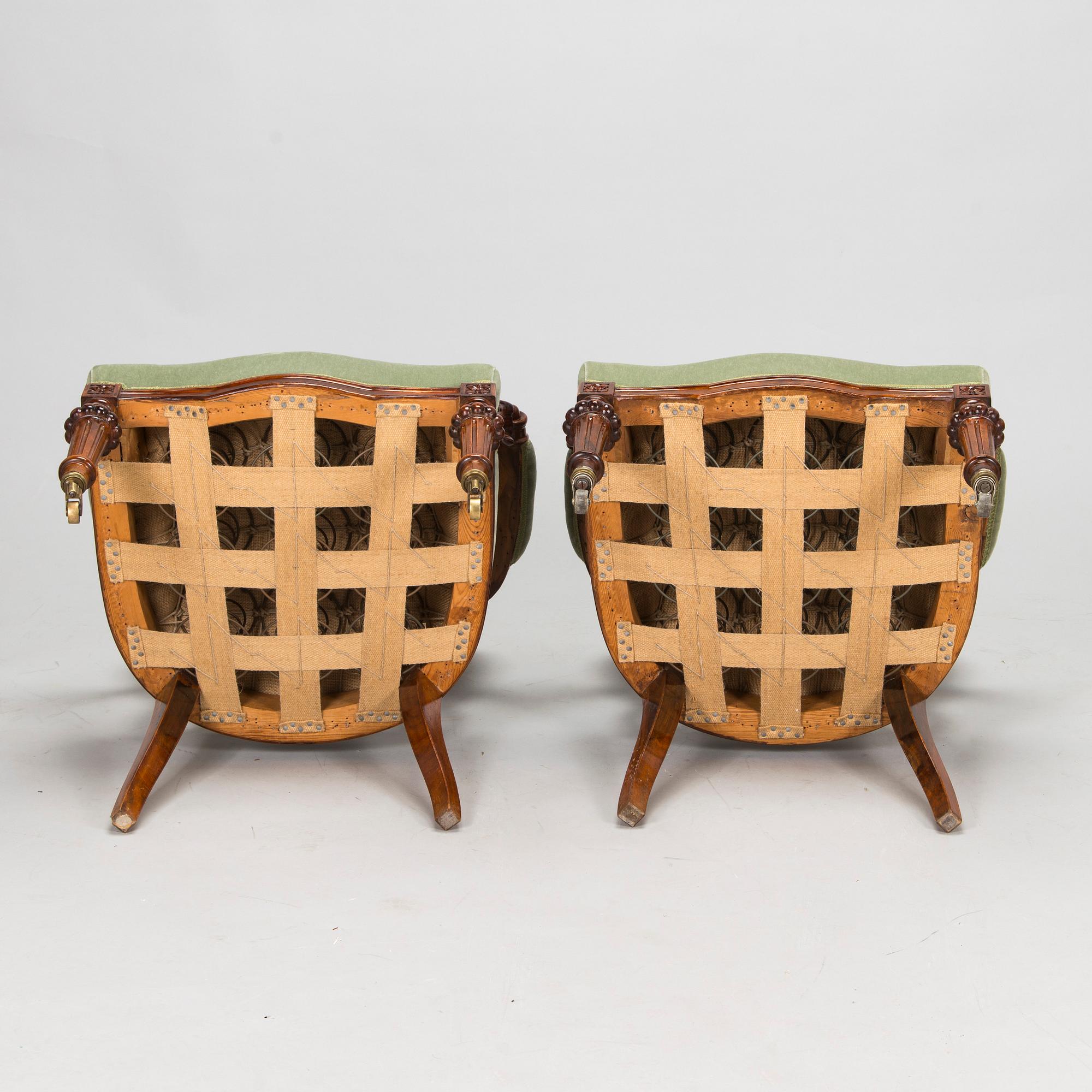 A pair of Russian armchairs and a table, late 19th century.