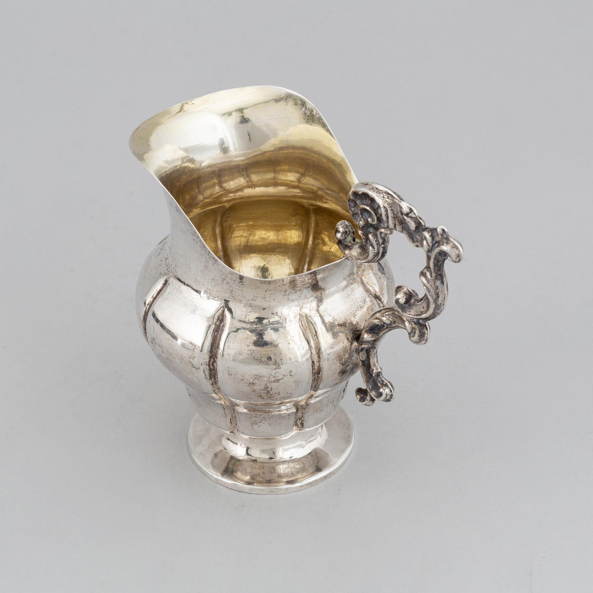 A Swedish 19th century parcel-gilt silver cream-jug, mark of Oskar Ahlström, Södertälje 1856.