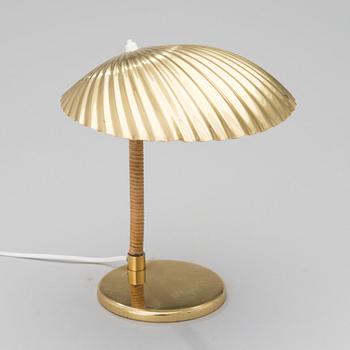 PAAVO TYNELL, A DESK LAMP. A shell.  Manufactured by Taito Oy. Designed in 1938/39.