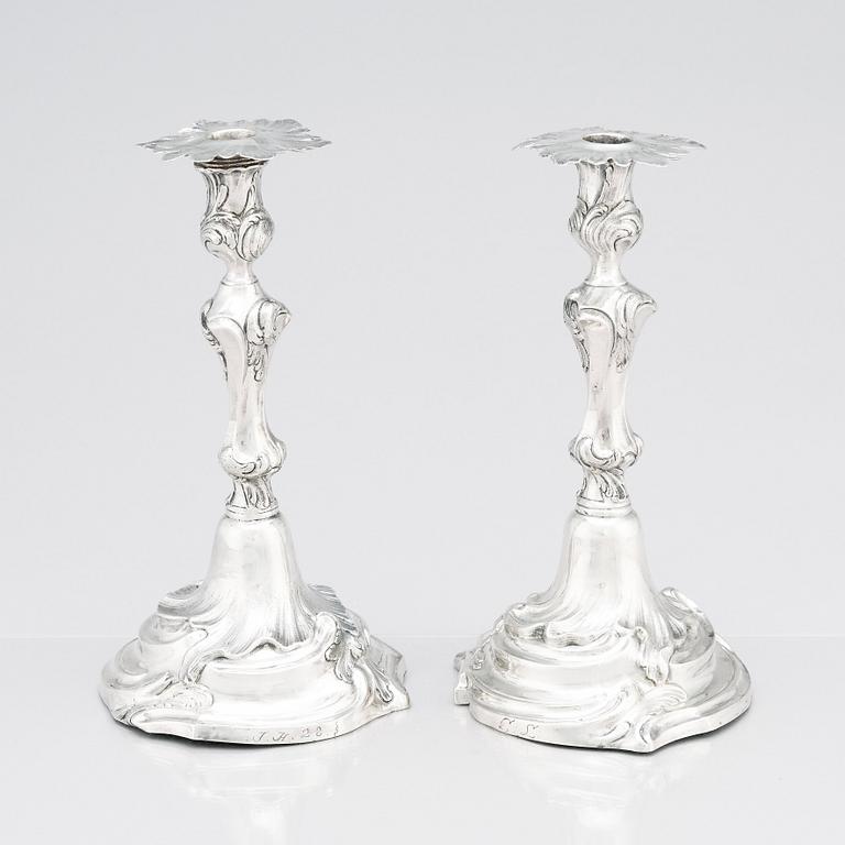 Two Swedish Rococo silver candlesticks, marks of Jakob Lampa, Stockholm 1764 and 1778.