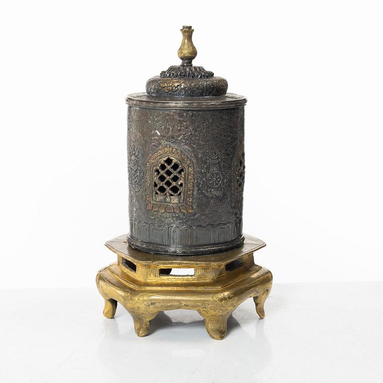 A silvered brass prayer container, Tibet, 20th century.