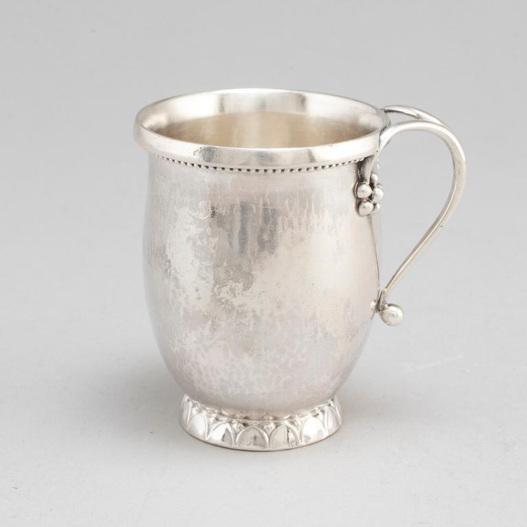 GEORG JENSEN,  a 830/1000 silver mug and  a bowl (a christening set), Copenhagen ca 1918-1927, design nr 127, 158.