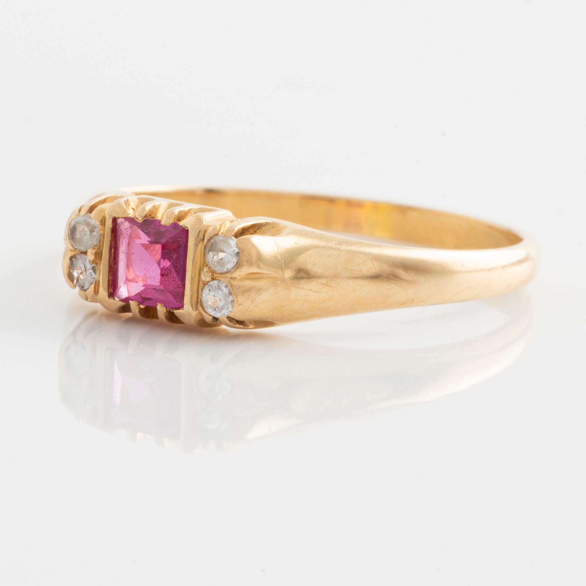 Ring, gold with synthetic pink stone and small white stones.